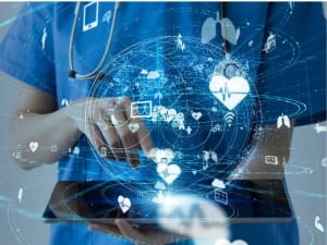 a picture of a healthcare worker on an electronic device, displaying an all in one solution.