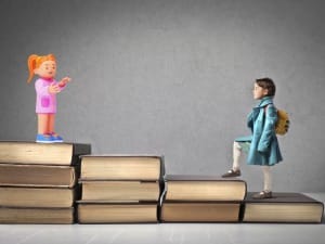 A picture of a child climbing up books to a child System C character.