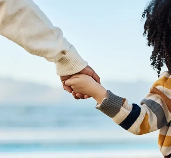 Parent and child holding hands