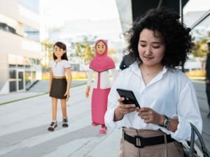 A picture of a female social worker on an electronic device with 2 System C social care characters in the background.