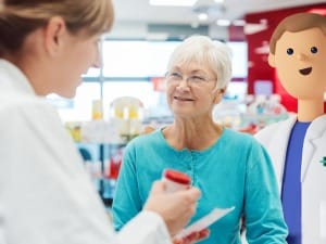 A patient engaging with a pharmacy employee within a pharmacy setting.