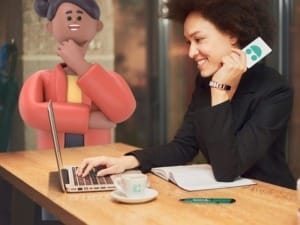 A woman with laptop and System C business card